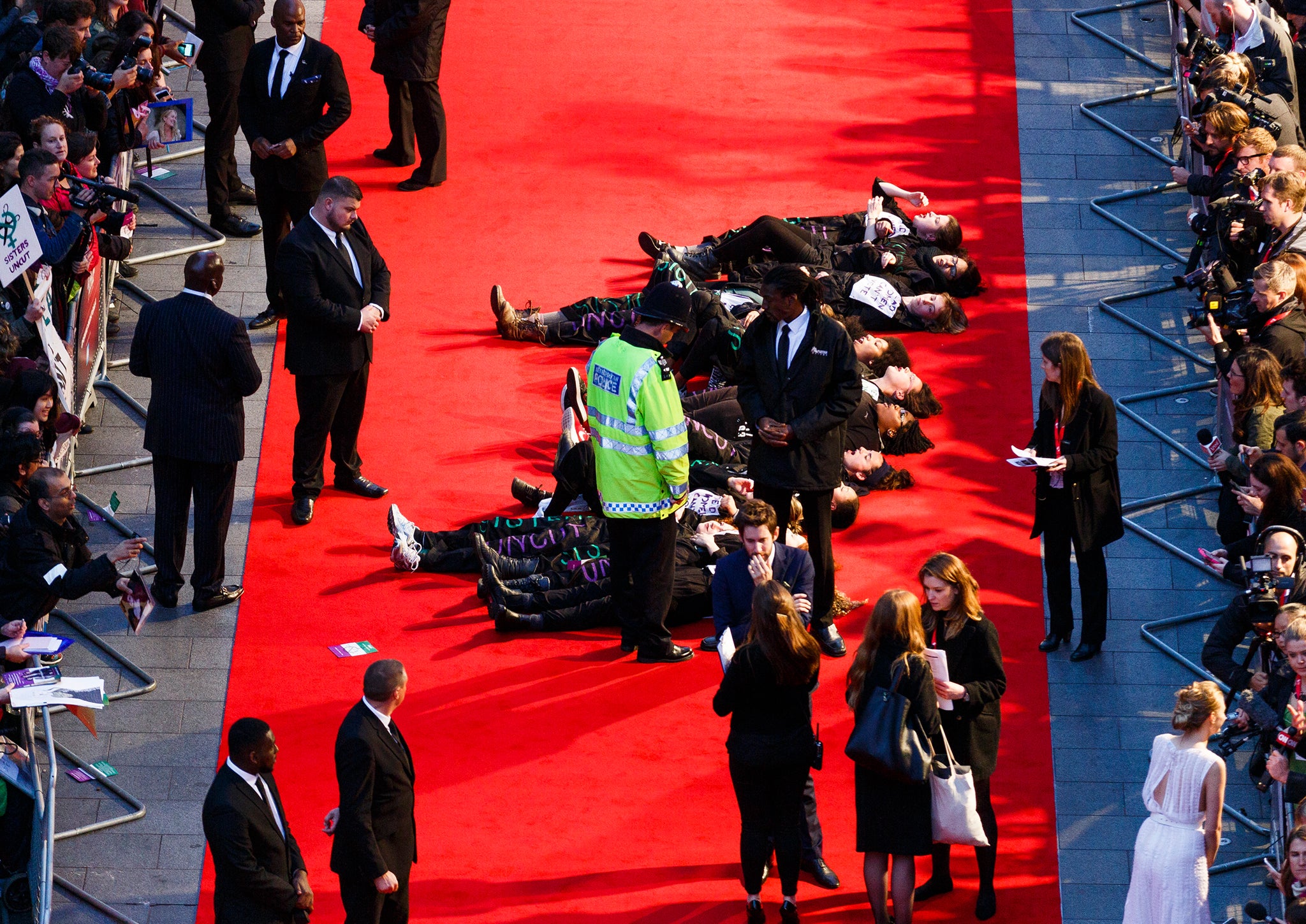 Activists protest the Suffragette Premiere during the Opening Night Gala during the BFI London Film Festival at Leicester Square on October 7, 2015 in London, England.