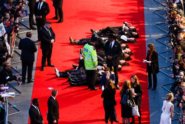 Activists protest the Suffragette Premiere during the Opening Night Gala during the BFI London Film Festival at Leicester Square on October 7, 2015 in London, England.