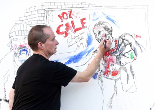 John Dolan working on StreetLink's At Your Fingertips’ mural