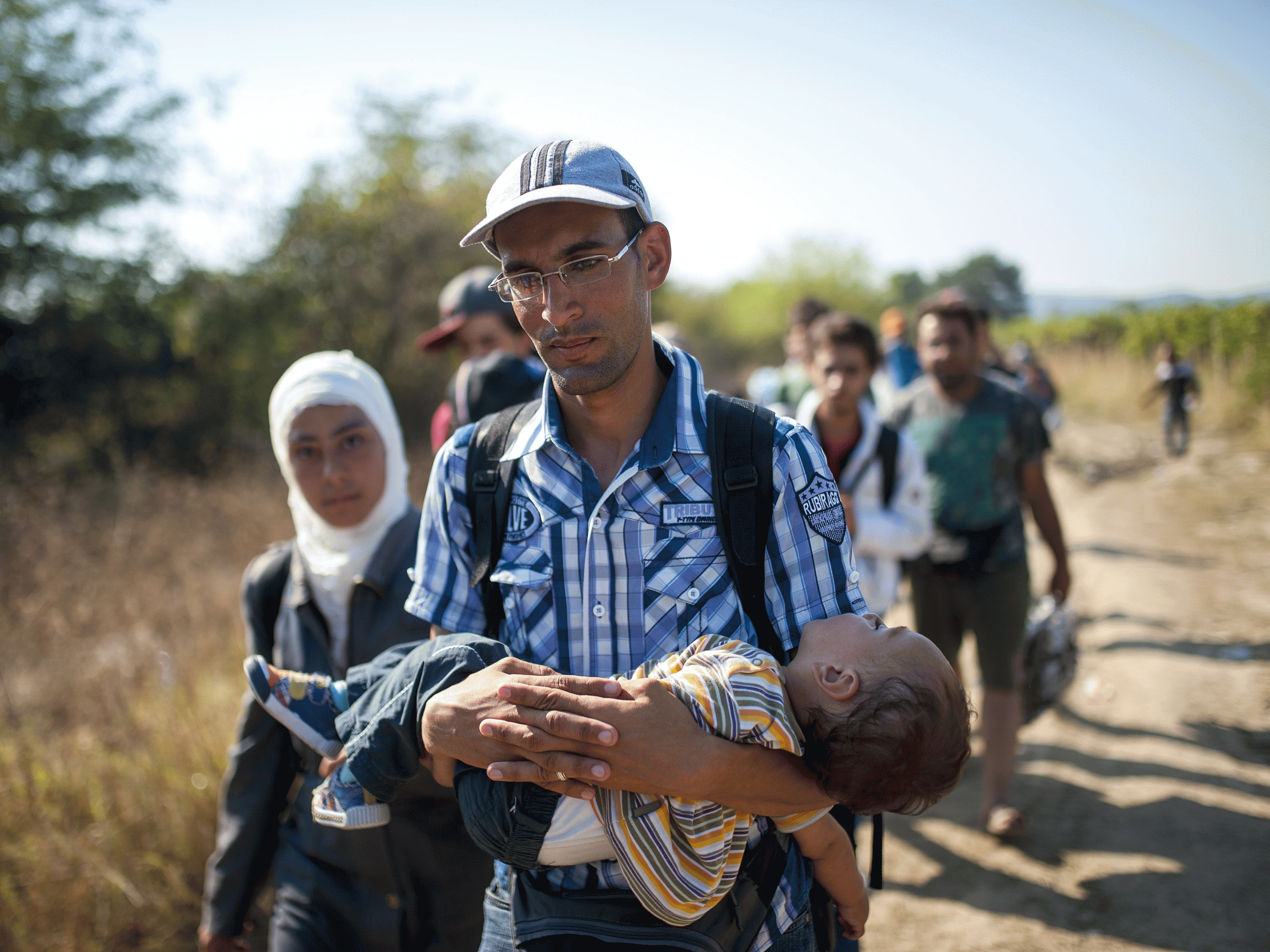 Many refugees are carrying children in their arms for miles as they make their journey to Europe