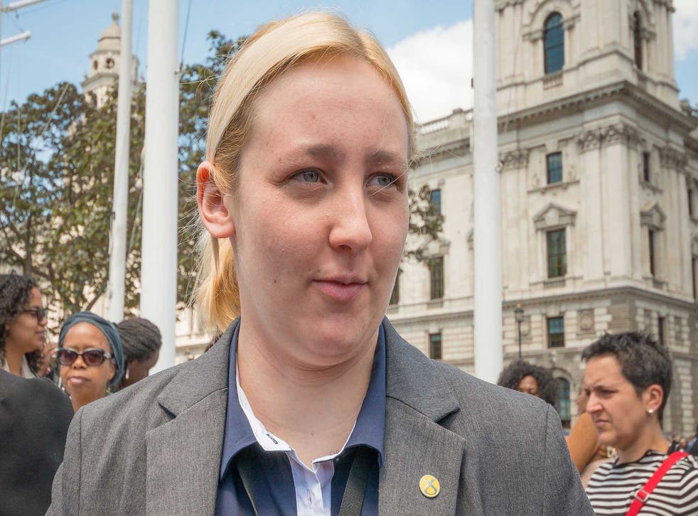 Mhairi Black standing in front of Whitehall at a protest to shut down Yarl's Wood Detention Centre