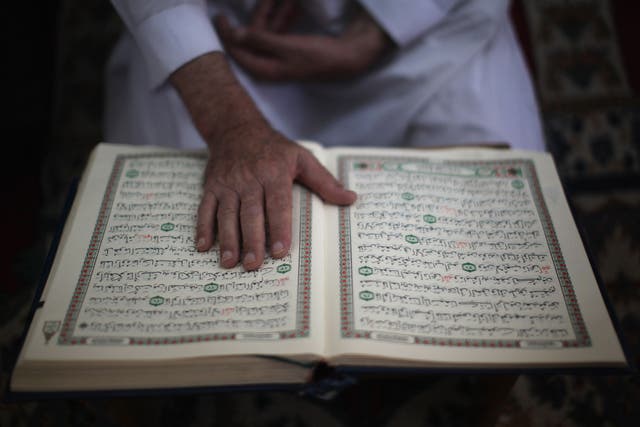 A man reads the Koran