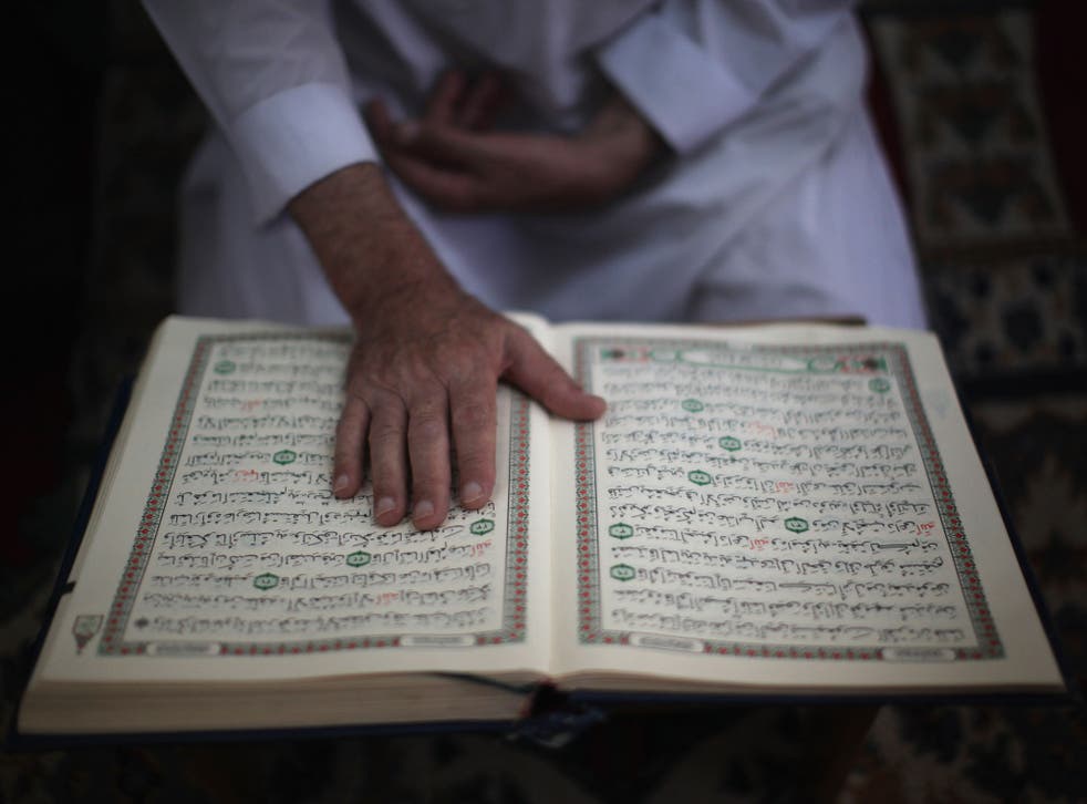 A man reads the Quran