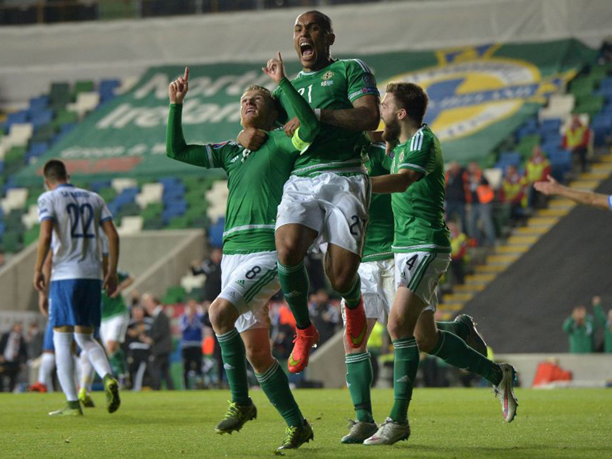 Steven Davis, left, celebrates the first of his two goals against Greece