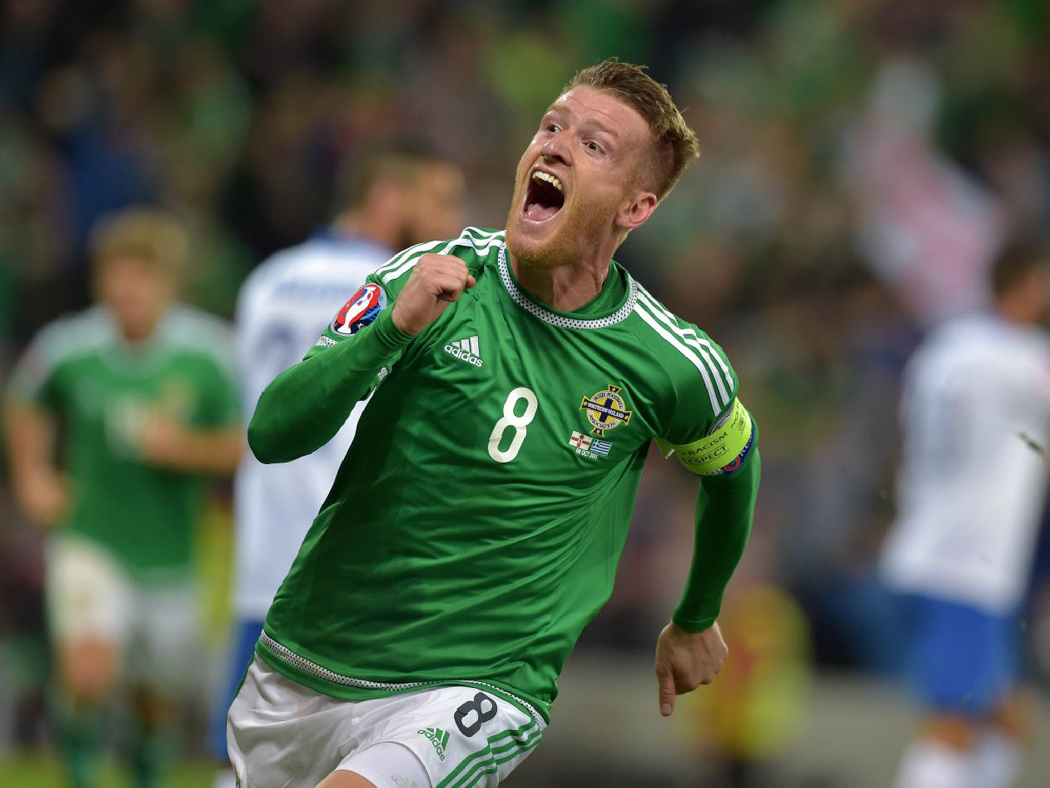 Steven Davis of Northern Ireland celebrates after scoring his side’s third goal against Greece in a 3-1 win in Belfast that takes them to Euro 2016