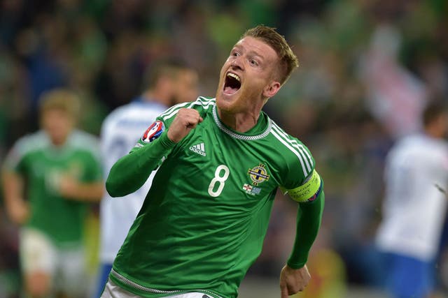 Steven Davis of Northern Ireland celebrates after scoring his side’s third goal against Greece in a 3-1 win in Belfast that takes them to Euro 2016 (