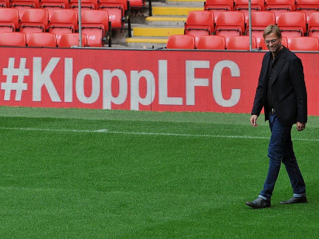 Jurgen Klopp walks out on the Anfield pitch