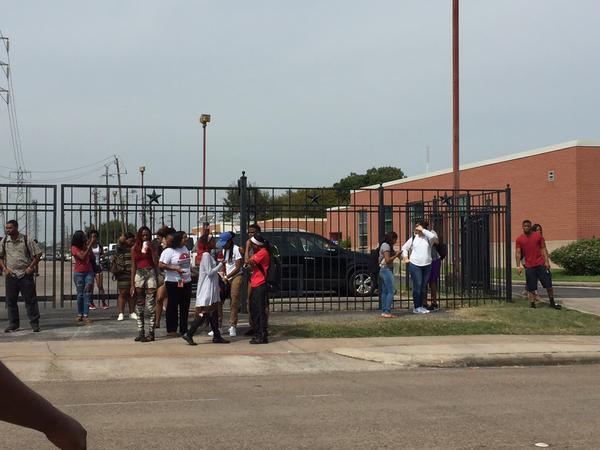 Students appear outside the student housing at Texas Southern University.