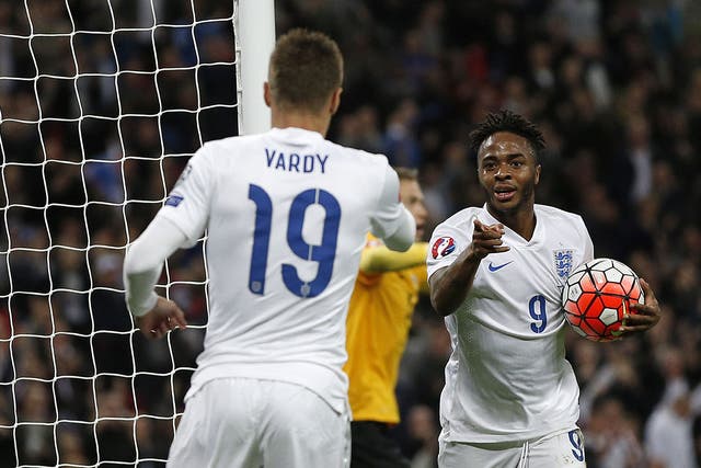 Raheem Sterling celebrates with Jamie Vardy after scoring for England against Estonia