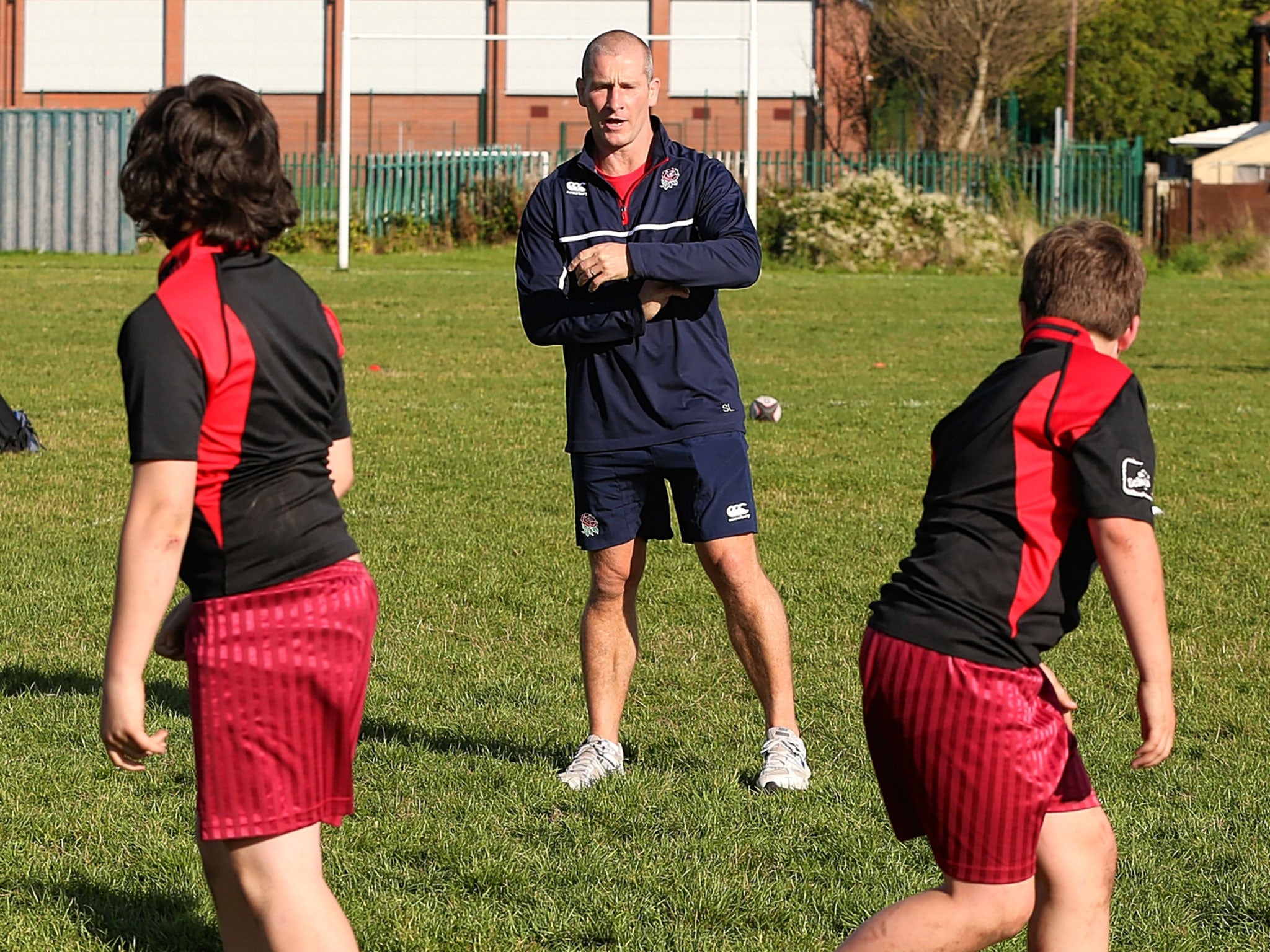 England coach Stuart Lancaster coaching youngsters in Manchester yesterday