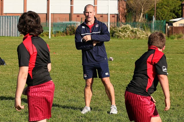England coach Stuart Lancaster coaching youngsters in Manchester yesterday