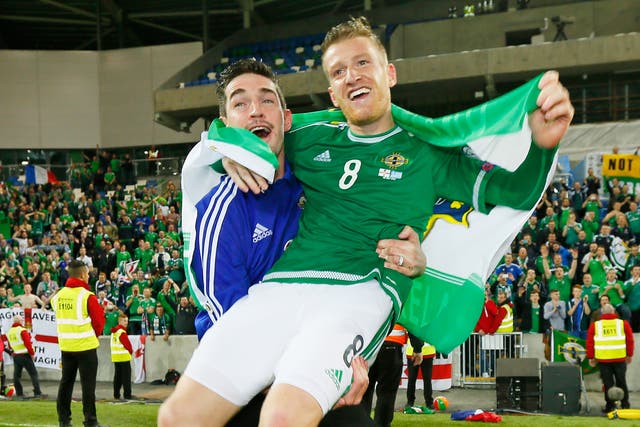 Steven Davis (right) and the suspended Kyle Lafferty celebrate after the victory over Greece on Thursday night