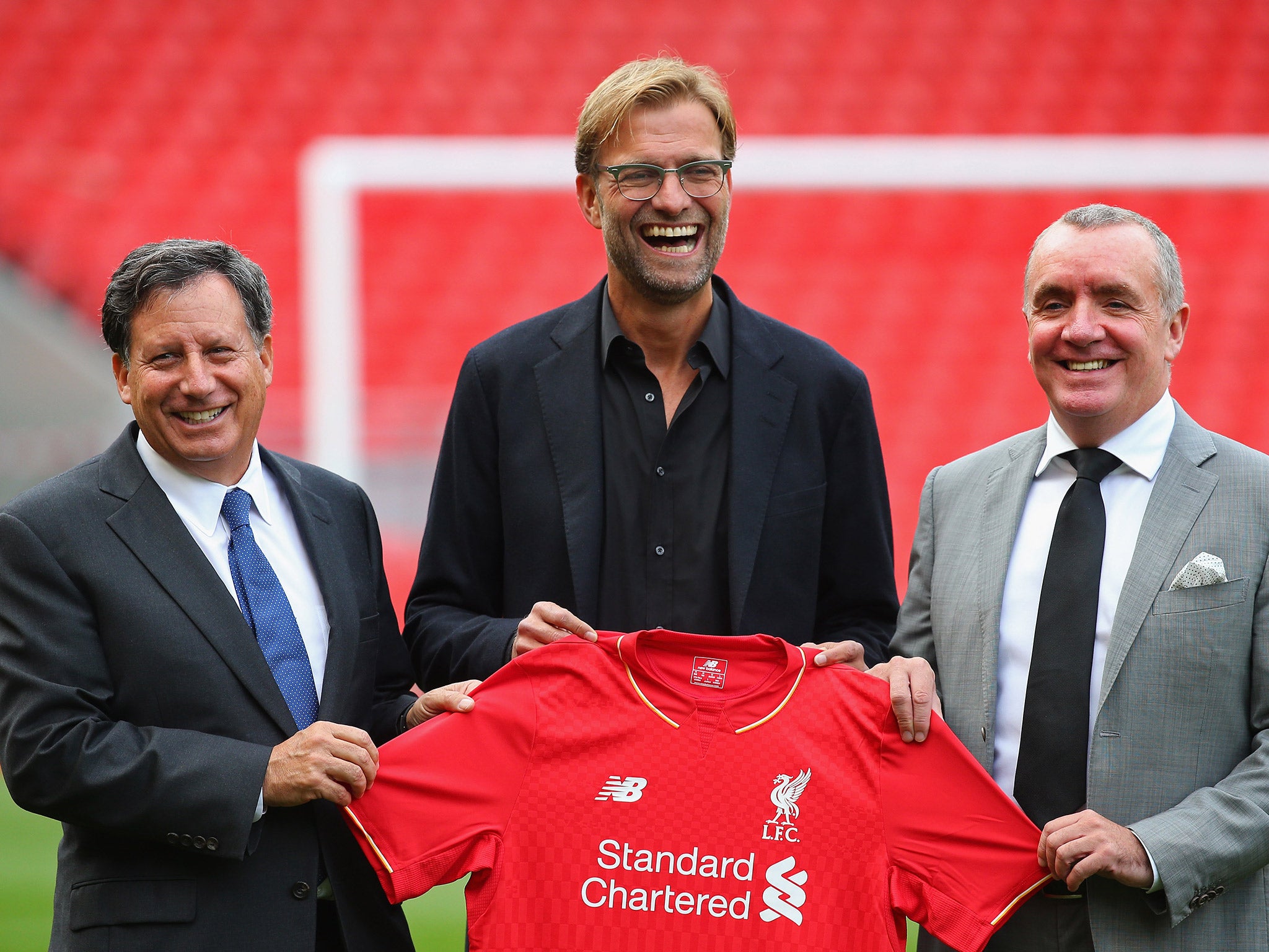 Klopp, centre, with Liverpool chairman Tom Werner and chief executive Ian Ayre