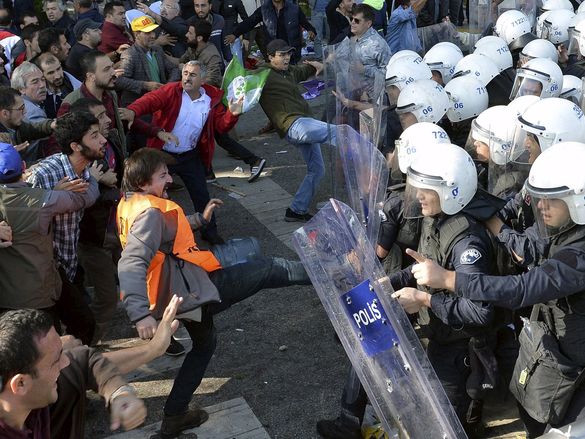 Demonstrators confront riot police following explosions during a peace march in Ankara, Turkey, October 10, 2015.