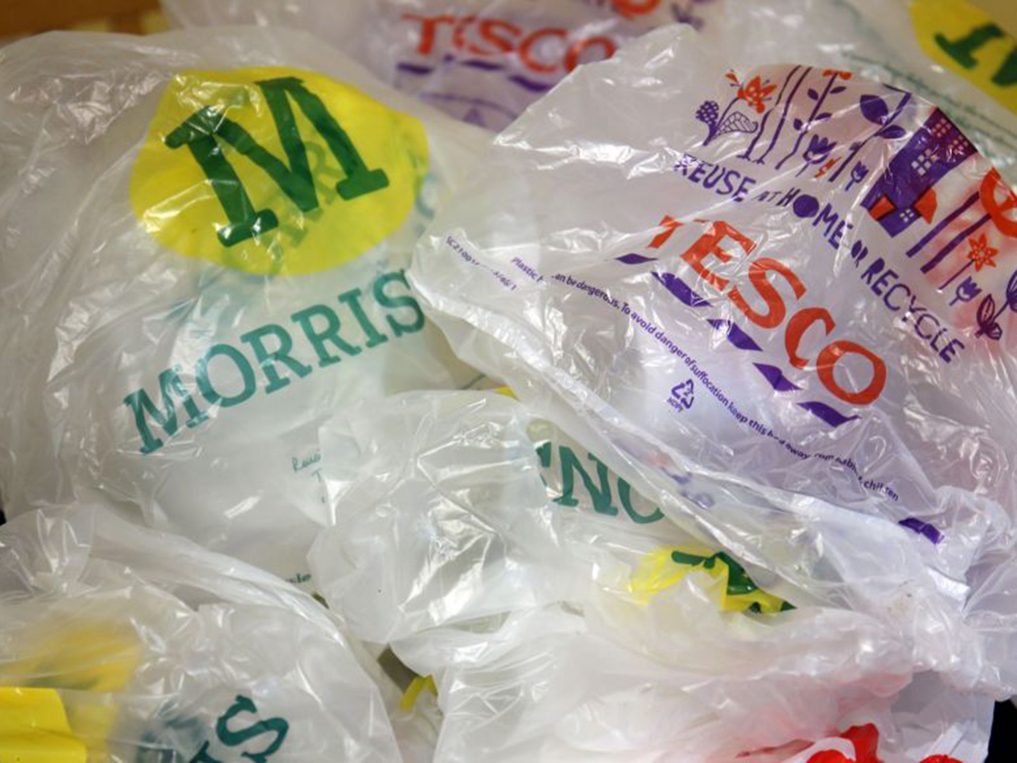 Shops have been required to charge 5p per plastic bag in England since October