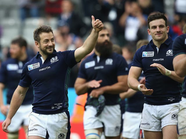 Greig Laidlaw celebrates after Scotland secure a spot in the quarter finals with a hard-fought win over Samoa