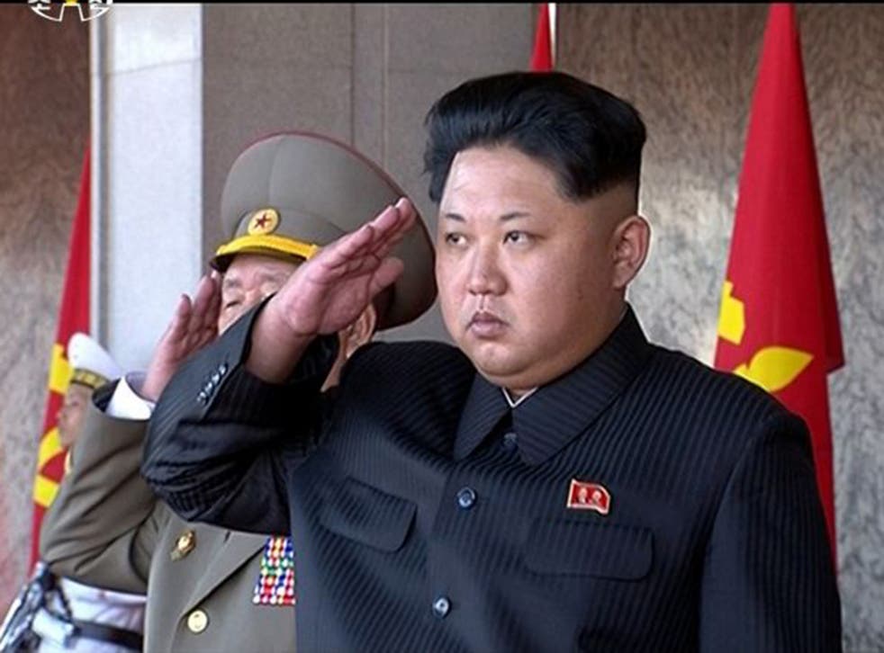 Kim Jong-Un takes the march-past salute on Saturday