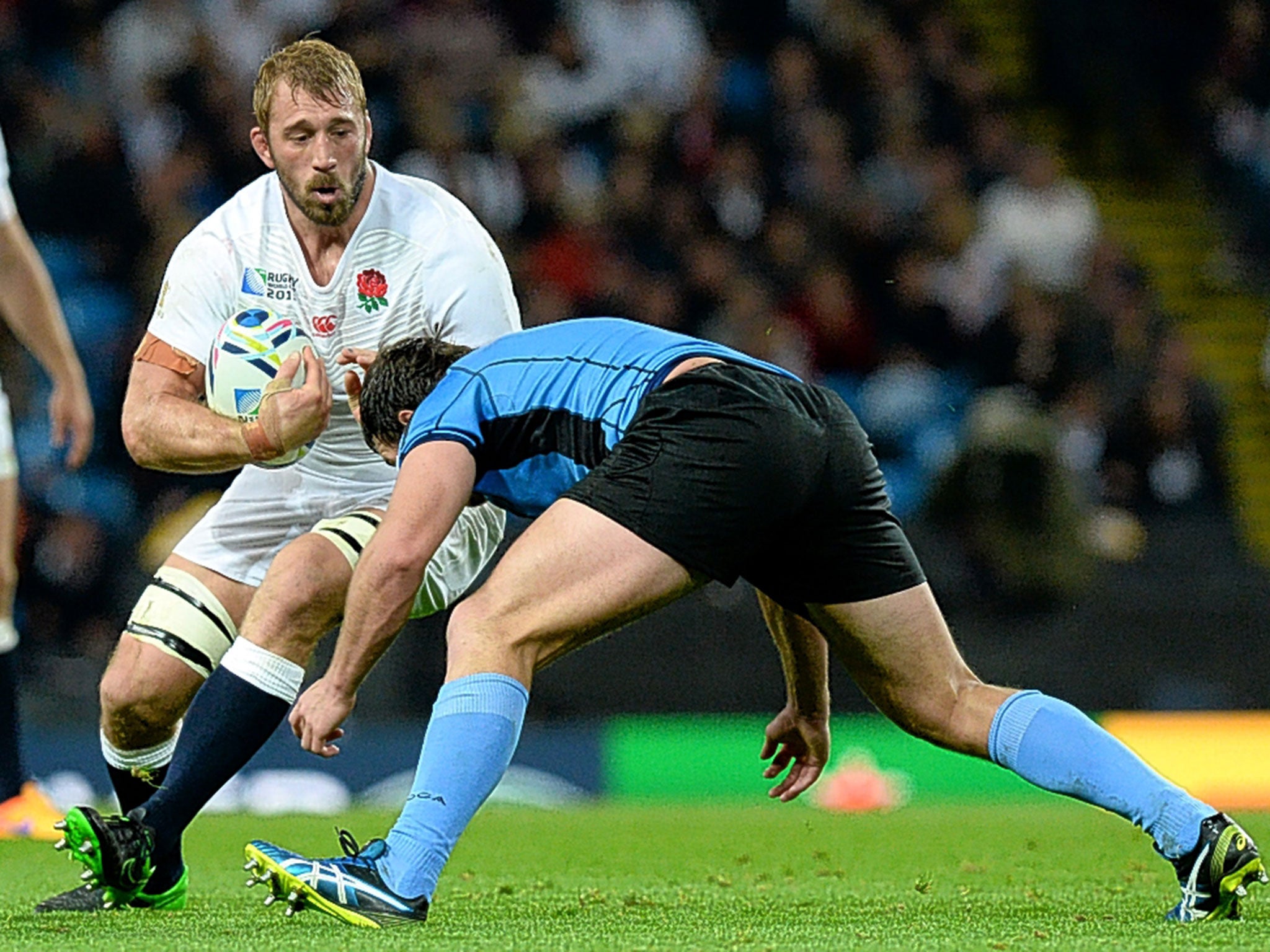 England captain Chris Robshaw is tackled by Matias Beer