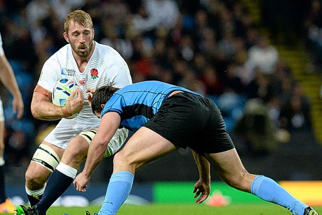 England captain Chris Robshaw is tackled by Matias Beer