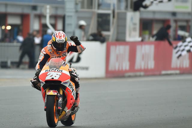 Dani Pedrosa punches the air after taking victory in Motegi