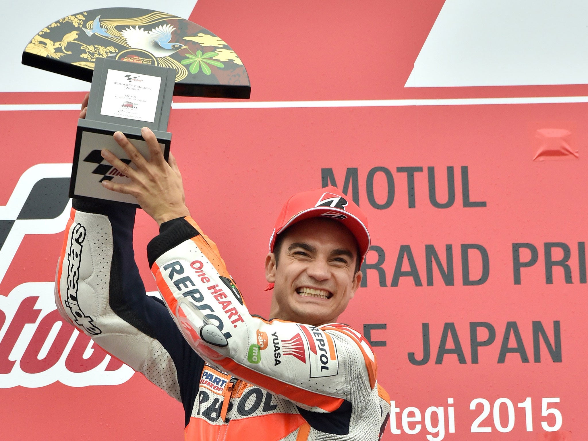 Dani Pedrosa lifts the trophy after winning the MotoGP Japanese Grand Prix