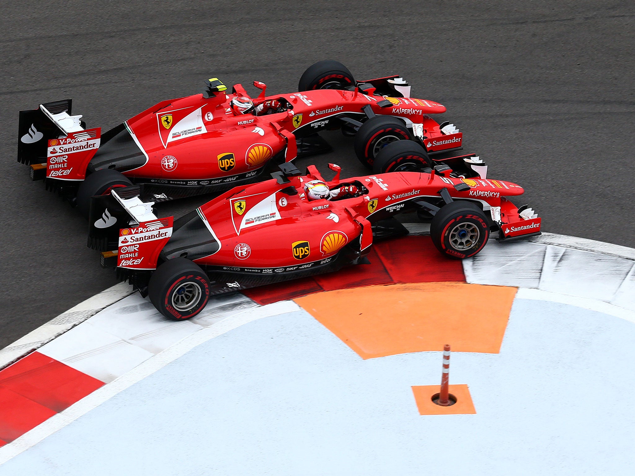 Ferrari driver Sebastian Vettel and Kimi Raikkonen battle for position