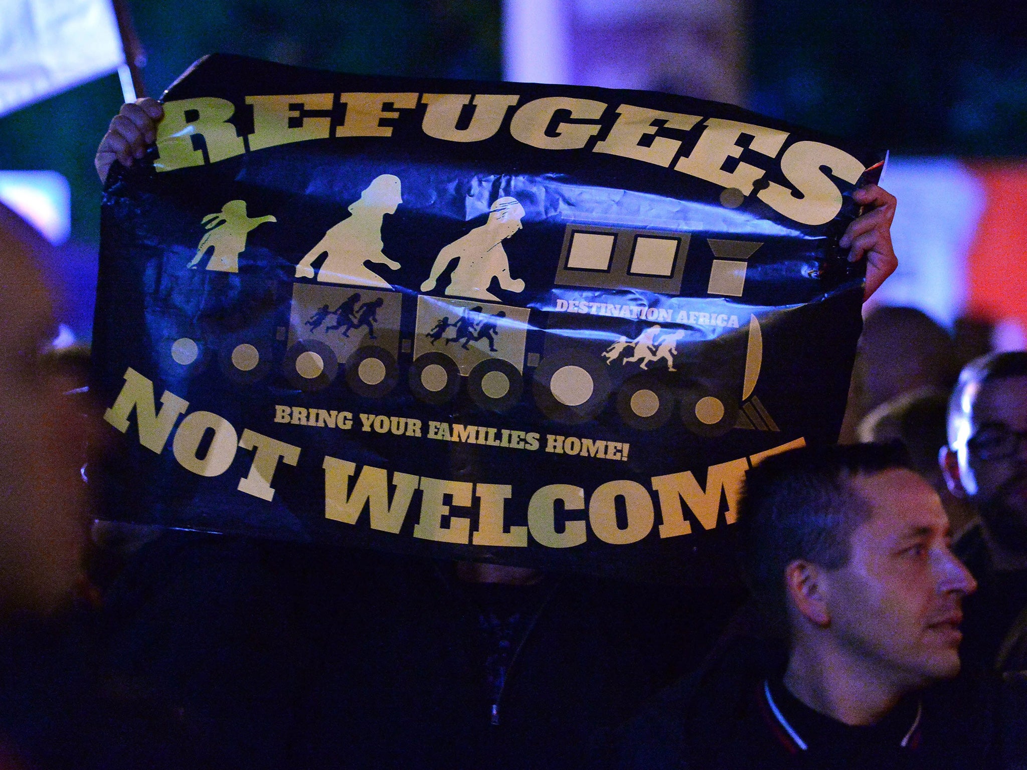 Demonstrators protest in the central city of Erfurt, 07 October 2015, against the asylum policy
