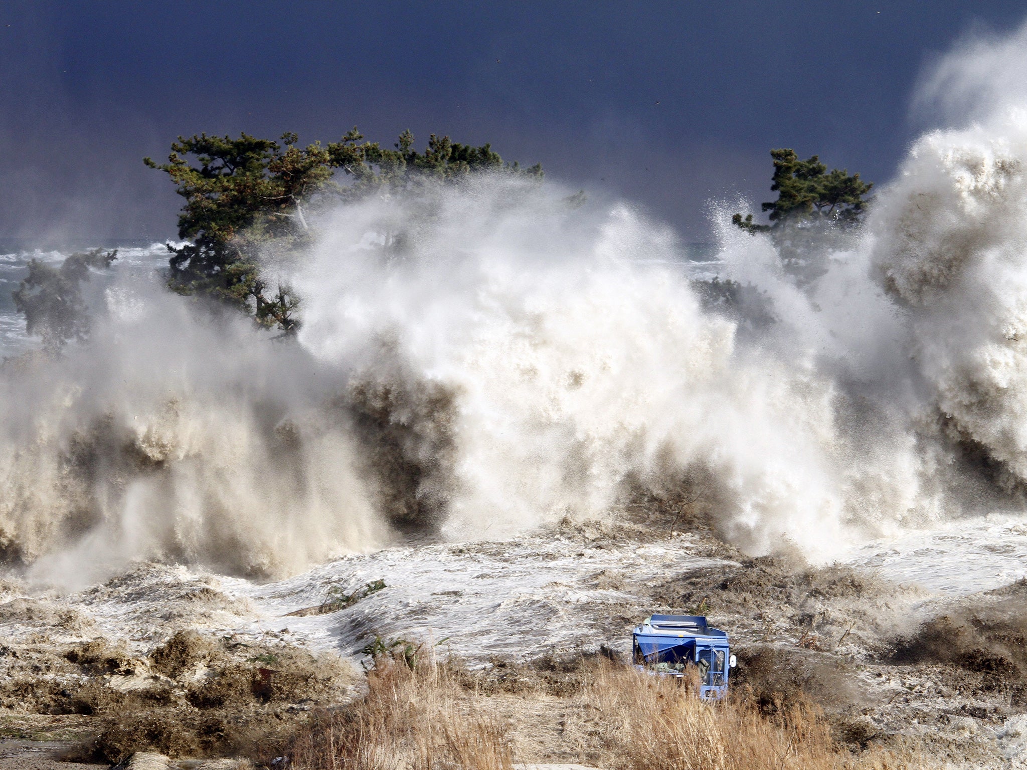 The tsunami smashes into the shore of Fukushima