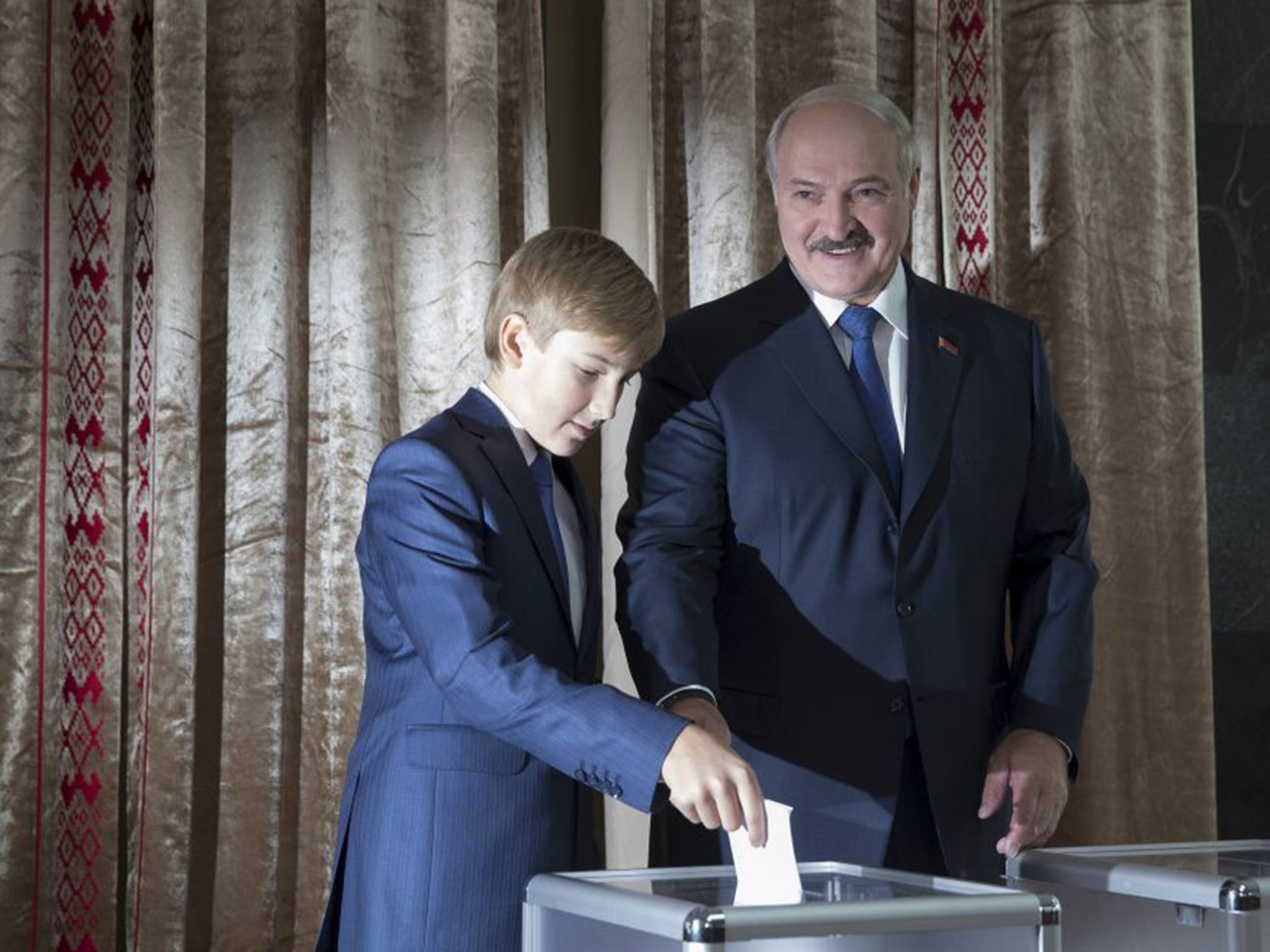 Alexander Lukashenko, with son Nikolay, casts his vote in Minsk