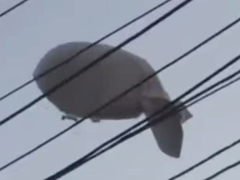 Video footage shows the balloon falling to the ground following the helicopter crash