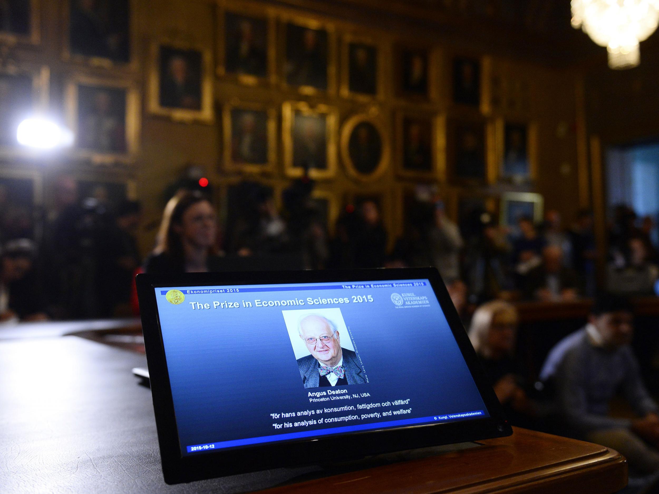 A picture of US-British Angus Deaton is displayed on a screen during a press conference to announce Deaton as winner of the 2015 Nobel Economics Prize on October 12, 2015 in Stockholm