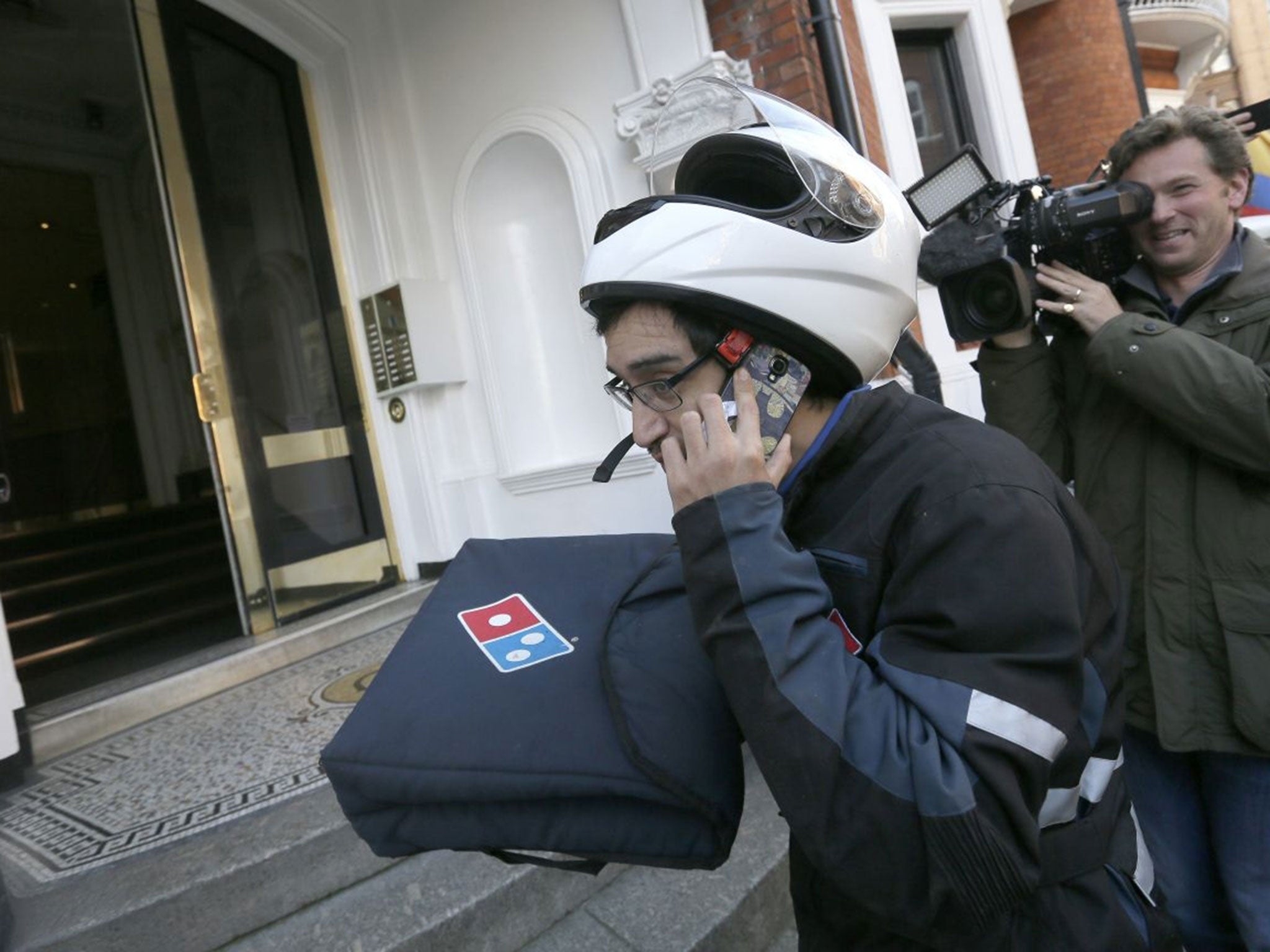 A pizza is delivered to the Embassy of Ecuador, in London