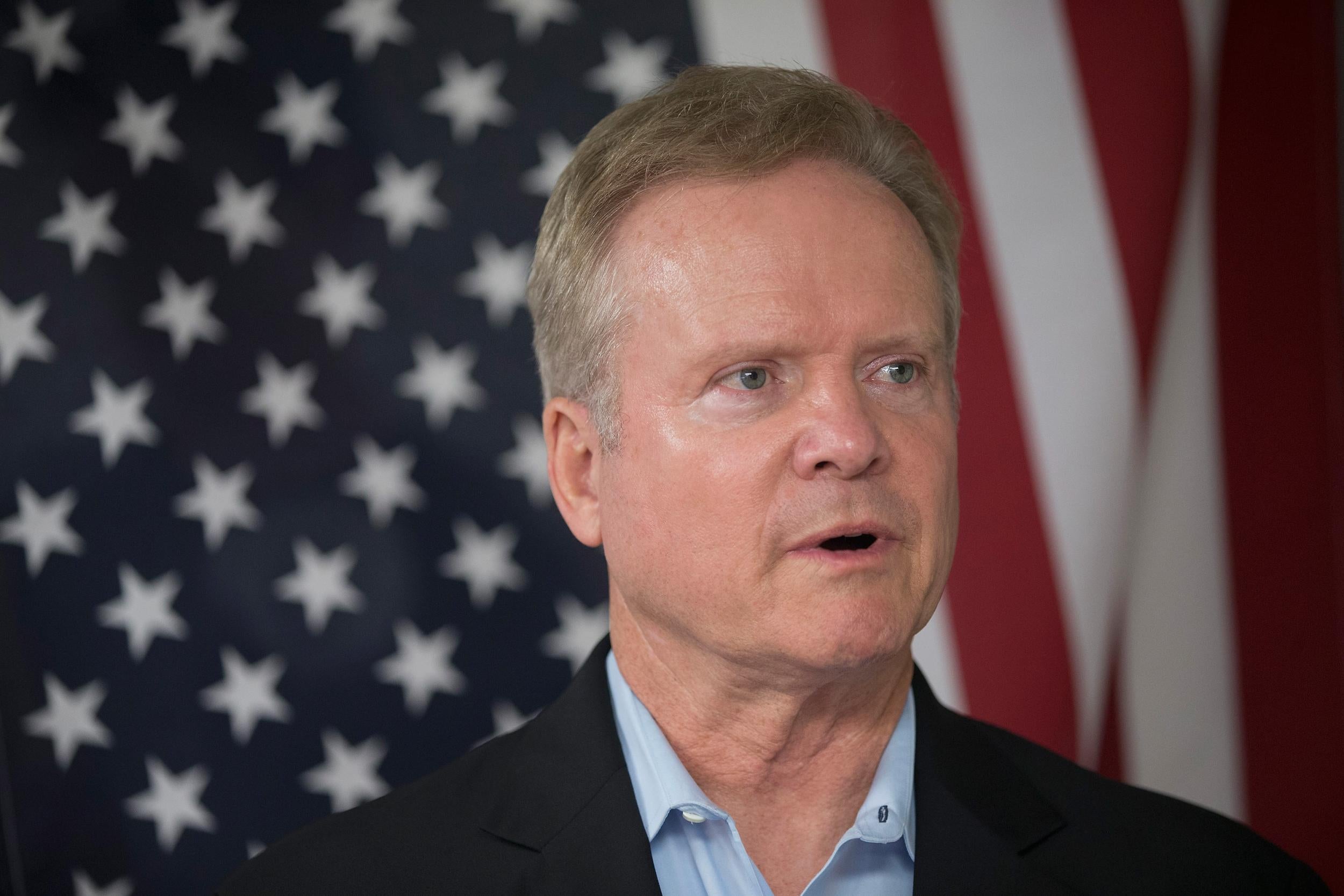 Jim Webb listens to speakers at the Urbandale Democrats Flag Day Celebration in Iowa. Getty