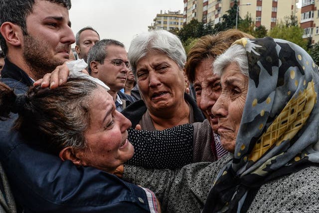Friends and relatives of one of the victims of Saturday’s bombing attacks mourn at his funeral in Ankara. No group has yet claimed responsibility for the twin bombing that killed at least 97 people in the Turkish capital