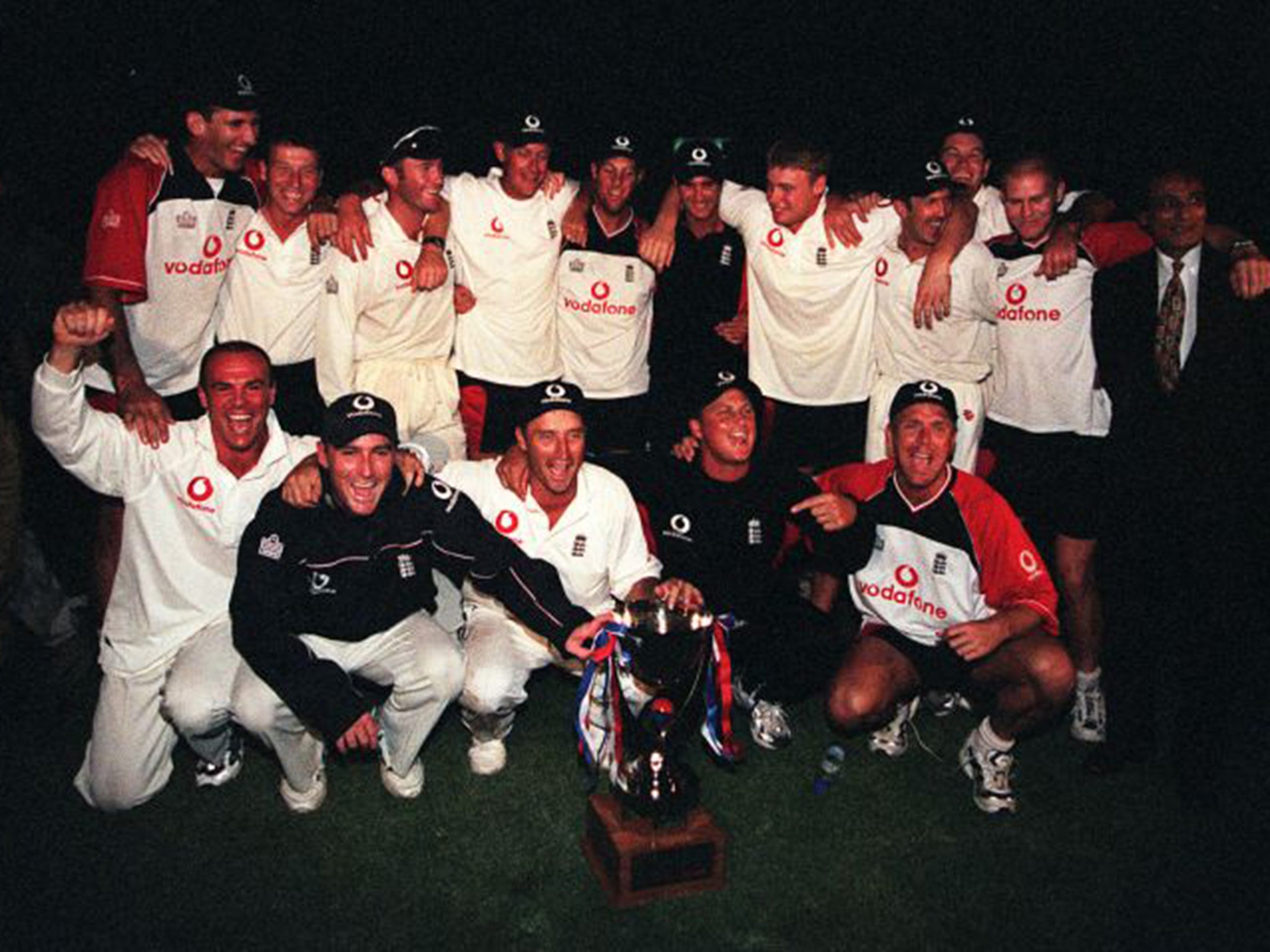 The England squad of 2000 celebrate their victory in the dark in Karachi