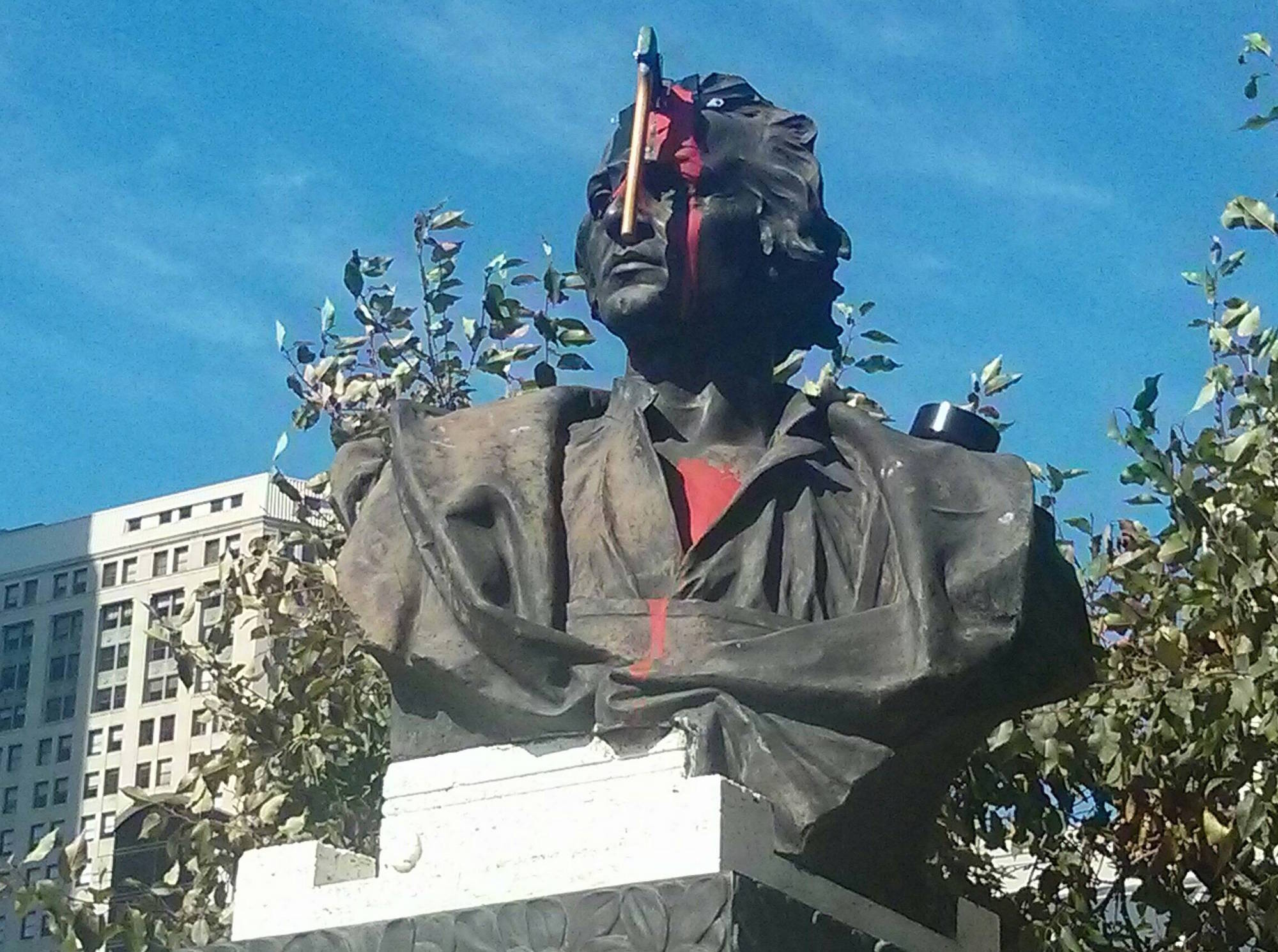 This Christopher Columbus statue has a new feature, a bloody hatchet to the forehead.