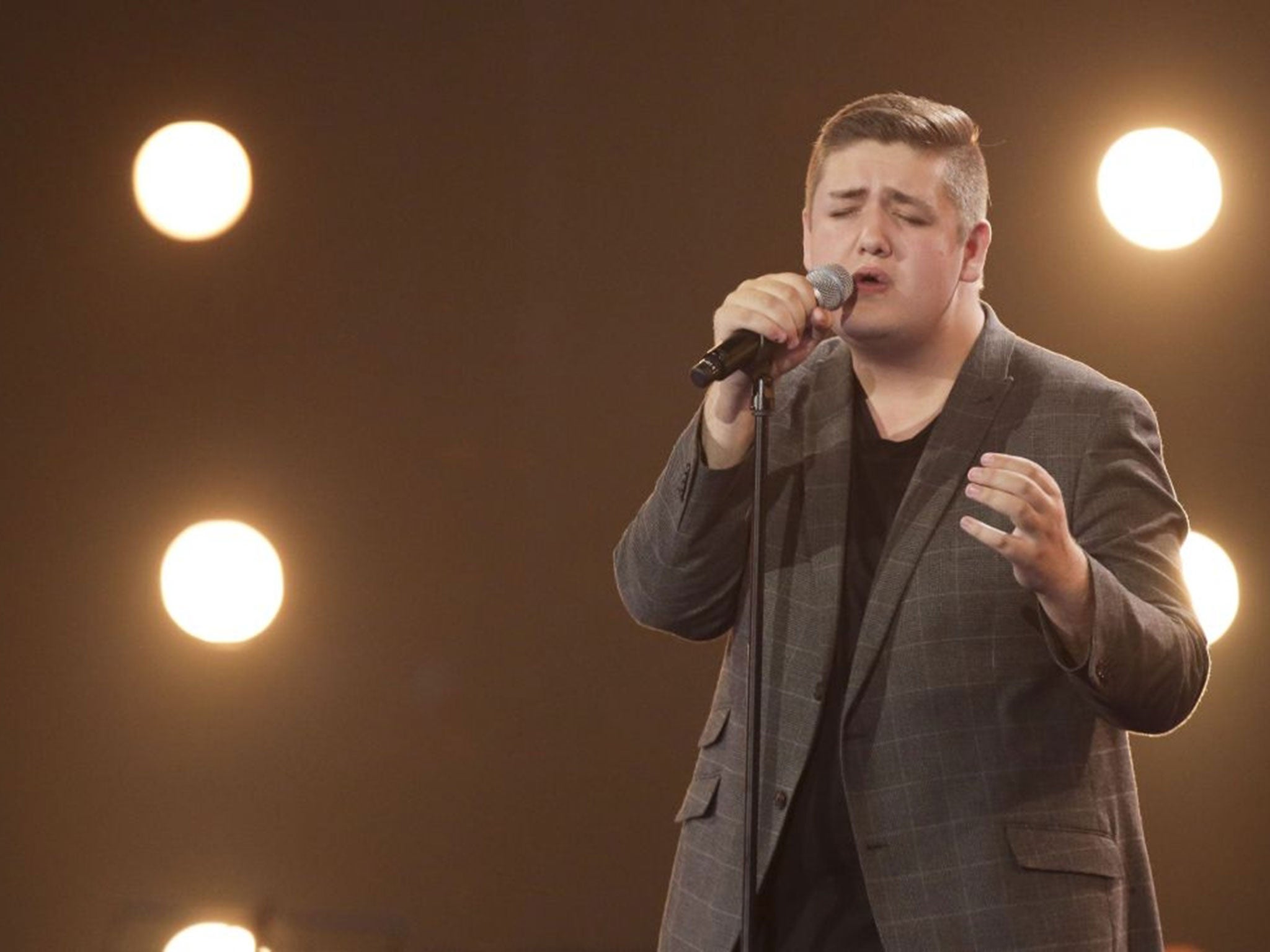 Tom Bleasby performing on the X Factor