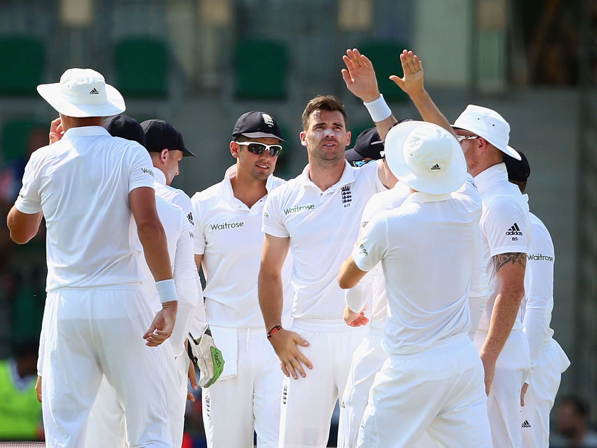 James Anderson of England celebrates with teammates after bowling Shan Masood of Pakistan during Day One of the First Test between Pakistan and England at Zayed Cricket Stadium