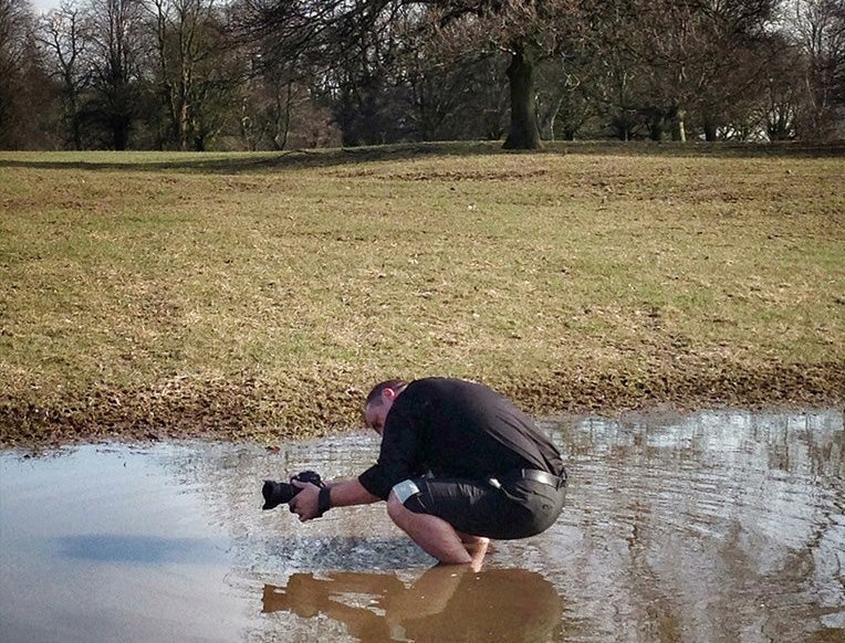 Chris Chambers doesn't mind getting dirty in pursuit of a picture. Chris Chambers Photography.