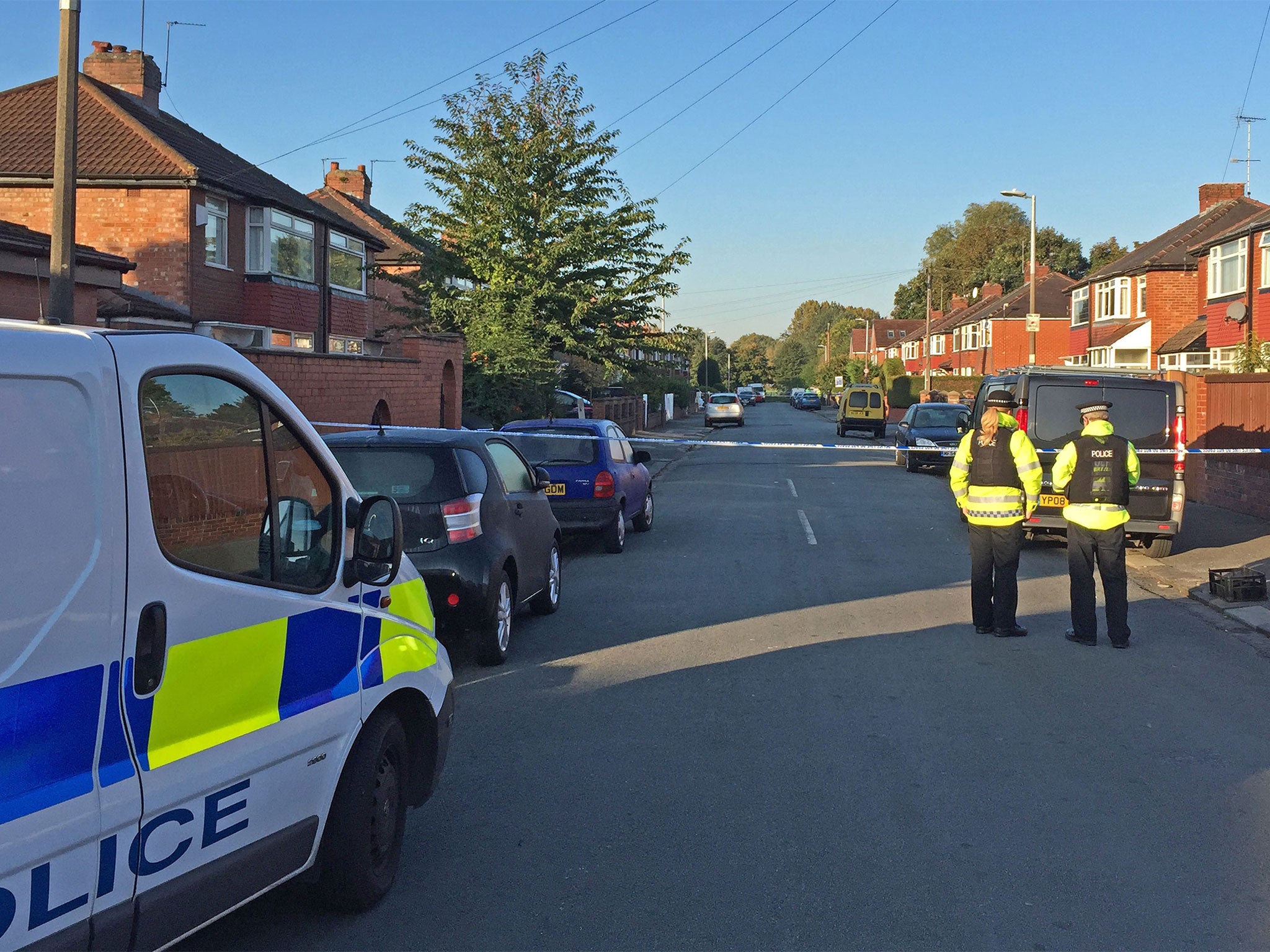 The pair suffered leg wounds and were taken to hospital after the attack in Gillingham Road, Salford
