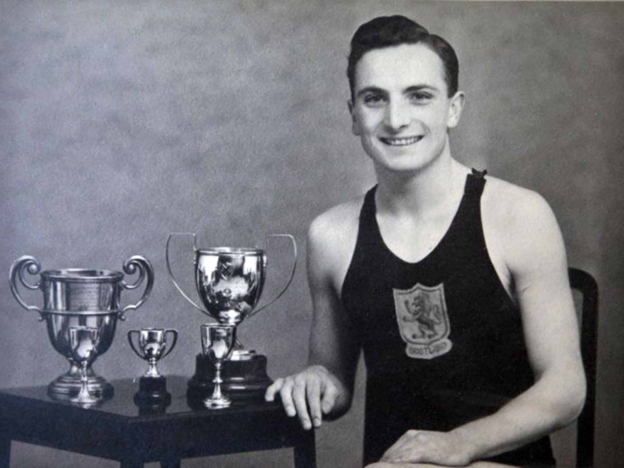 Heatly in 1942 with some of his trophies: 'I would like to have had what Tom Daley has now!' he joked in later life (PA)