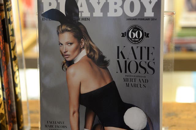 Kate Moss poses on the front cover of Playboy's 60th anniversary issue