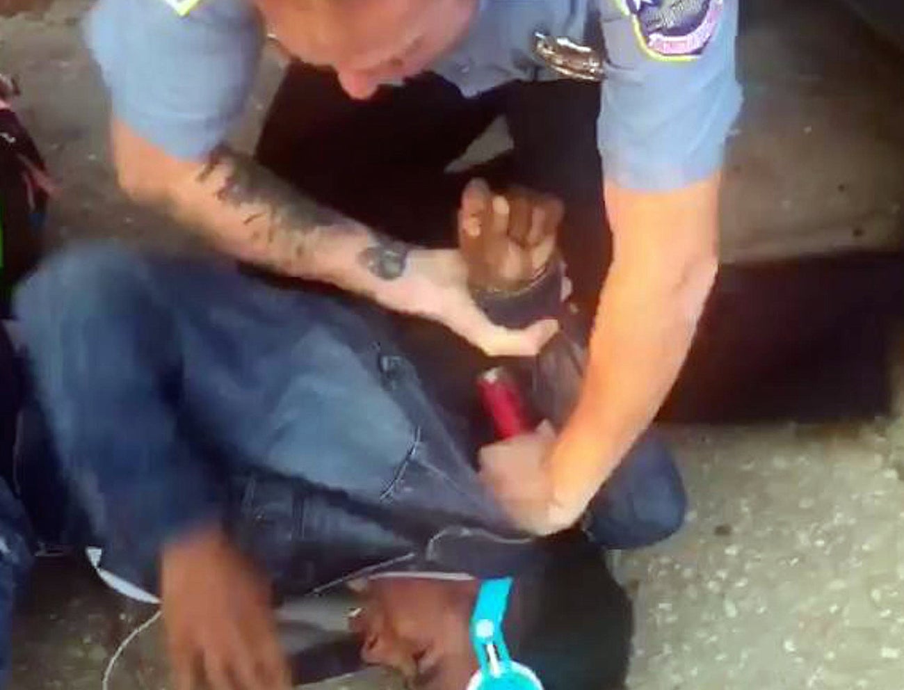 Cellphone video shows a young black man detained by police in Washington DC.