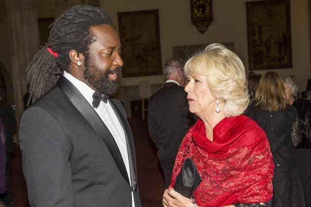 Marlon James speaks with the Duchess of Cornwall at the award ceremony