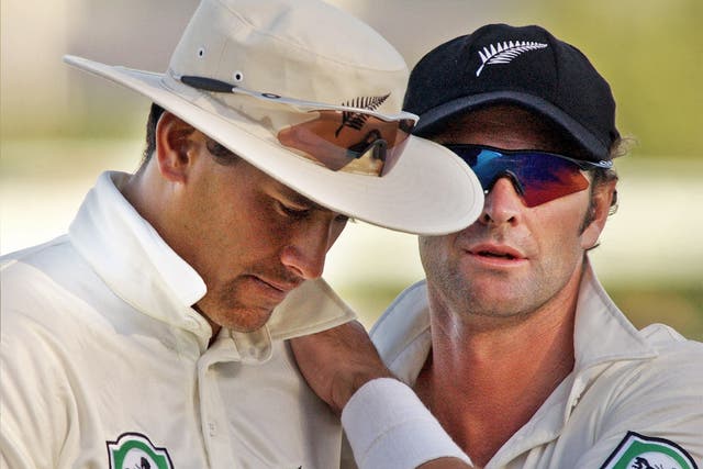 Daryl Tuffey (left) and Chris Cairns playing for New Zealand in 2003