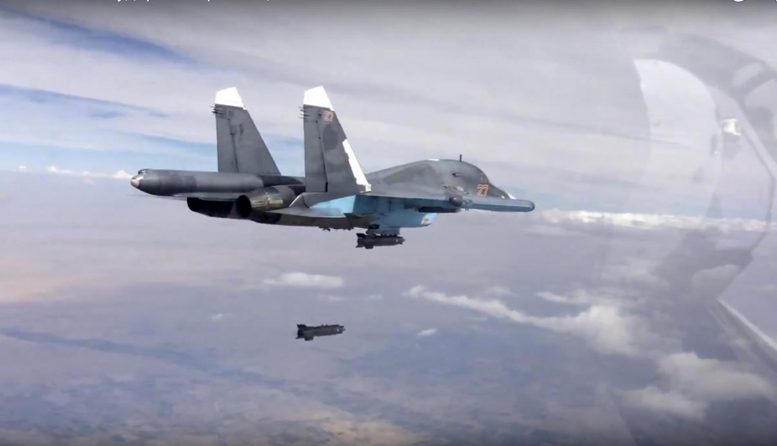 A Russian Su-34 strike fighter releases a bomb over Syria