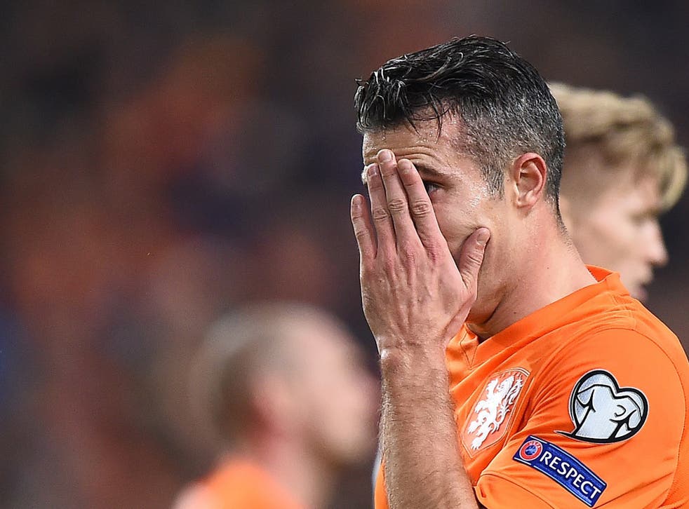 Robin van Persie reacts during the 3-2 defeat