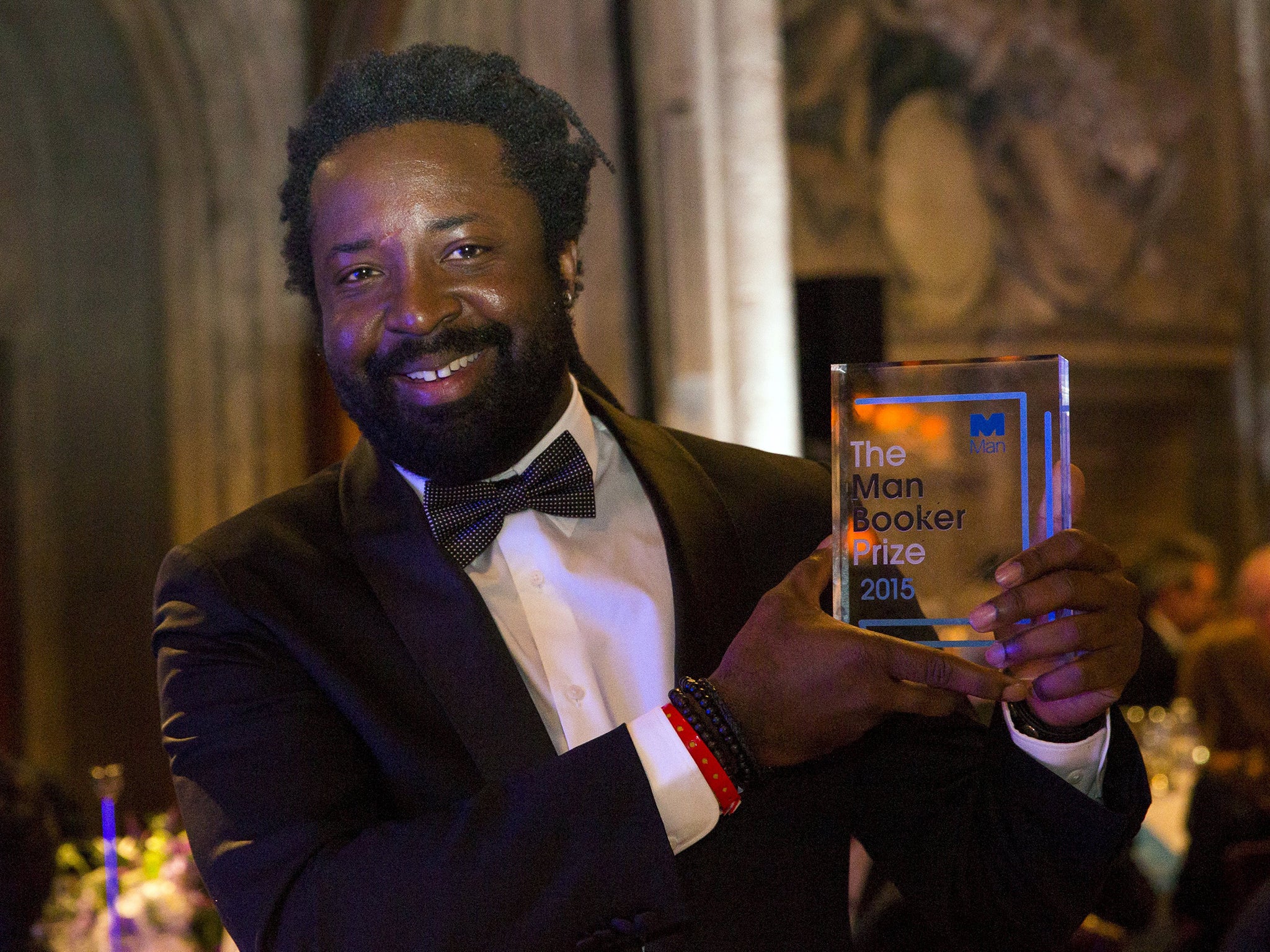 Author Marlon James winning author of "A Brief History of Seven Killings", poses with his award at the ceremony for the Man Booker Prize for Fiction 2015 at The Guildhall in London