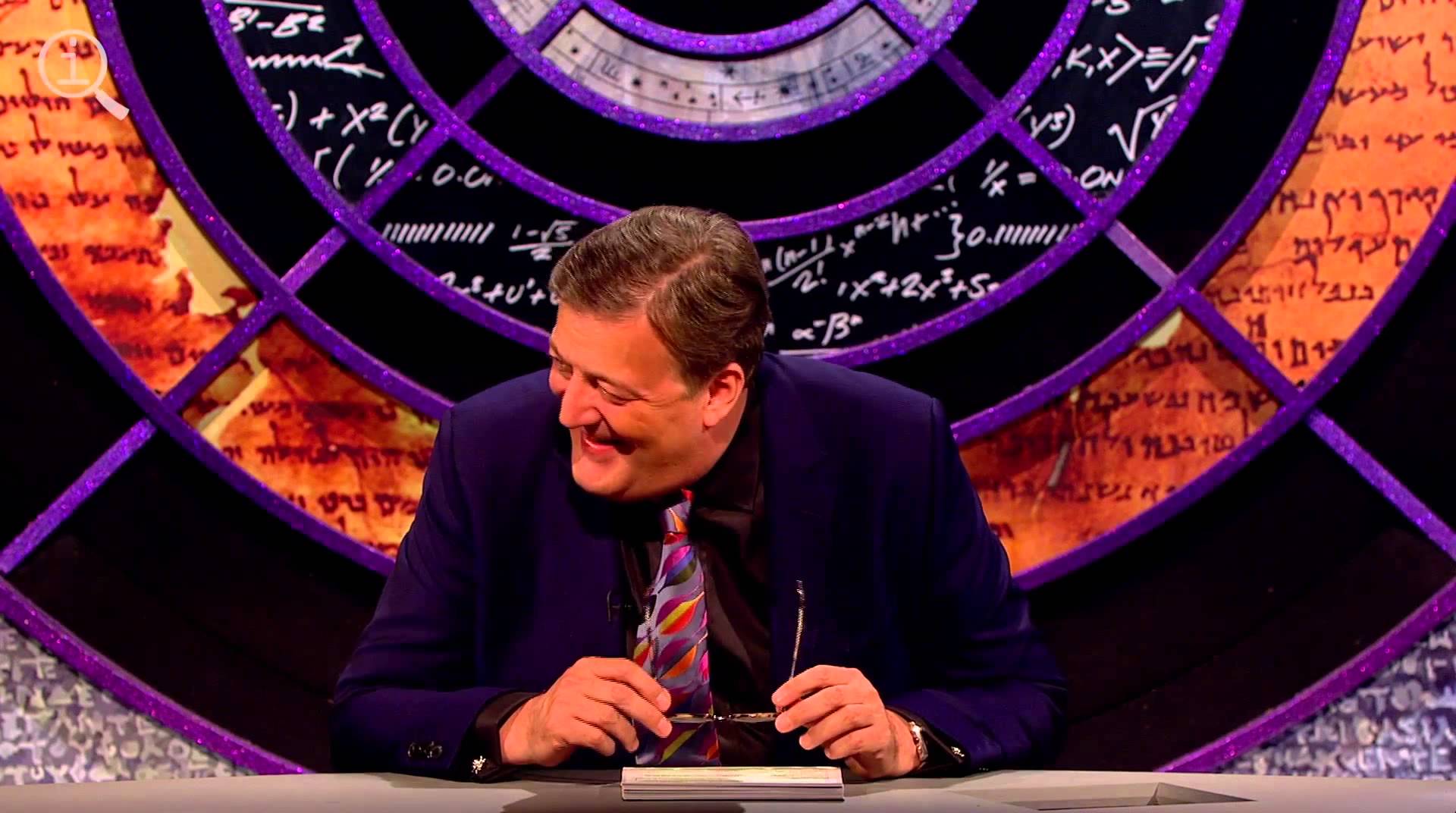 Stephen Fry presenting the comedy show QI