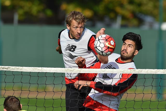 Lucas, left, challenges Emre Can for the ball in a training session earlier this season
